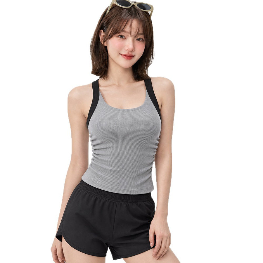 One-piece sports bra with chest pads for yoga enthusiasts