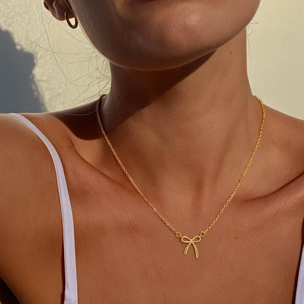 Elegant Bow Design Necklace with Inlaid Pearls for Women